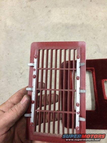 Red vent grille with metal clips