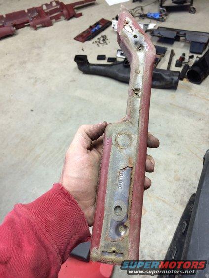 Red interior car part with visible part number '010101'