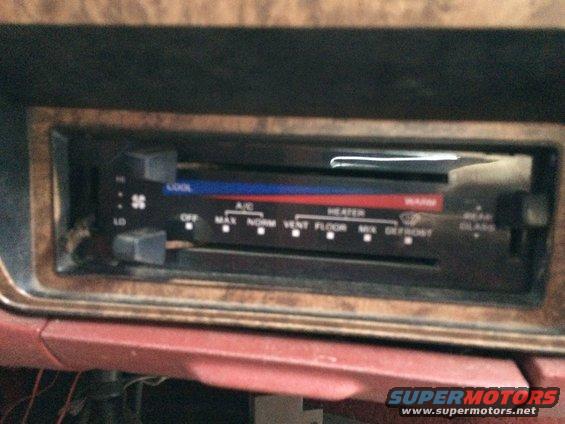 Interior climate control panel with temperature and fan speed sliders, and mode selector
