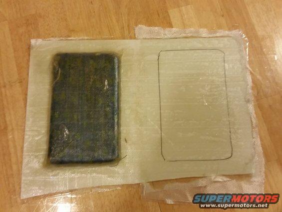 Fiberglass mold with a dark rectangular insert and a traced outline