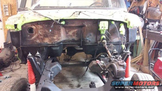 1978 Ford Bronco engine bay with red shocks and exposed engine components