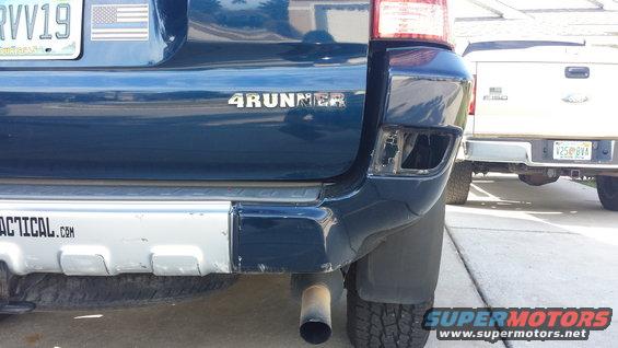 Blue 4Runner with damaged rear bumper and tactical.com sticker