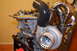 2007 Mazda 6 - Close-up of a turbocharger and exhaust manifold assembly mounted on an engine block.