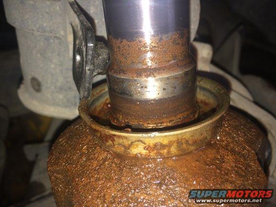 Rusted CV shaft and seal with visible Supermotors.net logo