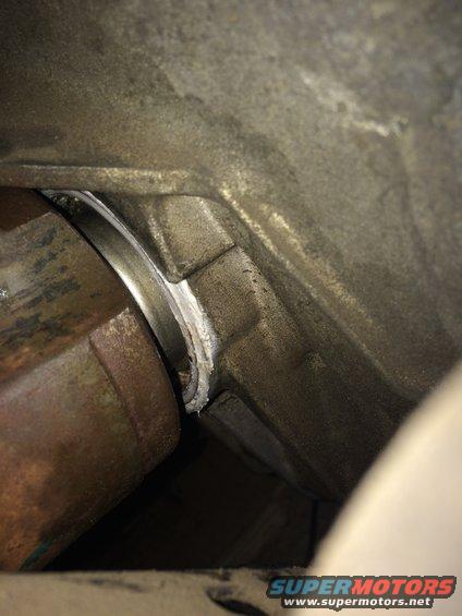 CV shaft entering a transmission housing with a visible seal