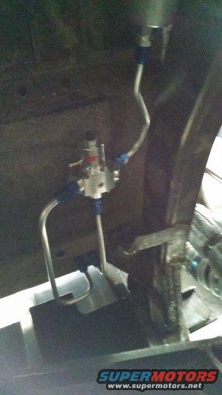 fuel pressure regulator with blue fittings and metal lines
