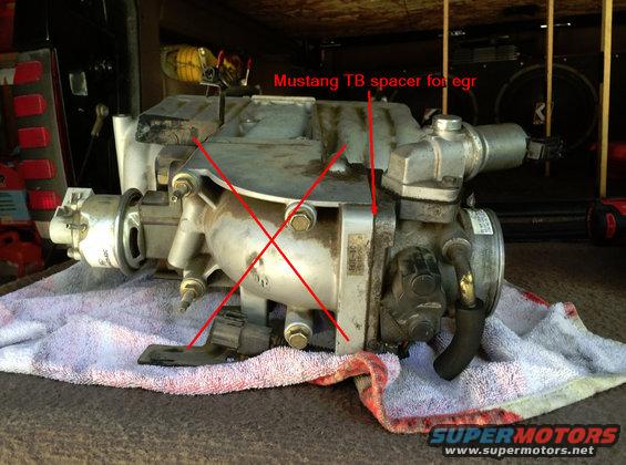 Ford Explorer 5.0 upper intake manifold with red lines pointing to a Mustang TB spacer for EGR