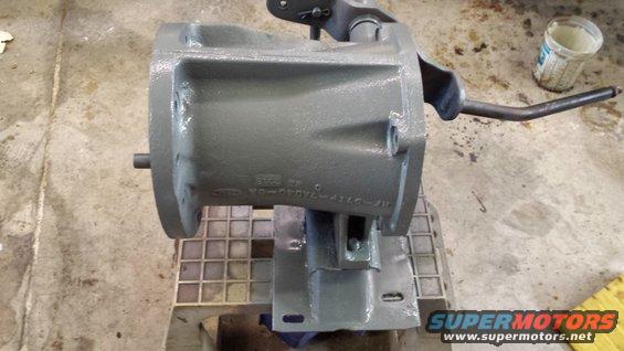 Gray painted Ford transmission housing with part number visible