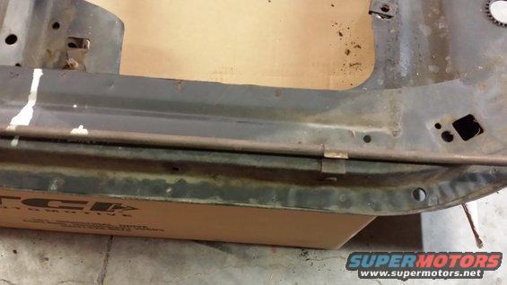 rusted metal frame section with TCI Automotive logo on box below