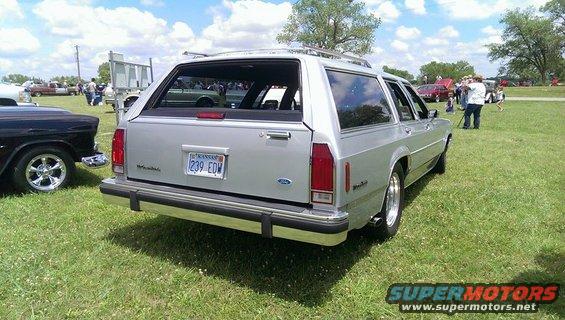 silver station wagon parked on grass, Kansas plate 239 EDW