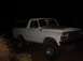 1979 Ford Bronco - This lifted 1979 Ford Bronco is shown in a three-quarter front view at night.