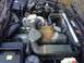 1988 BMW 7 Series - A bird has made a nest in the engine bay of this vehicle, filling the space with dried vegetation.