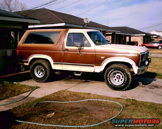 Brown and tan 1980 Ford Bronco parked in driveway