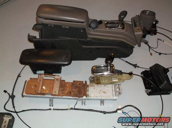 Disassembled car center console and shifter assembly with wiring
