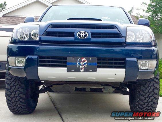Blue 2005 Toyota 4Runner front view, lifted suspension, large off-road tires, custom license plate
