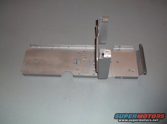 Metal bracket assembly with various holes and mounting points, likely for undercarriage or interior component
