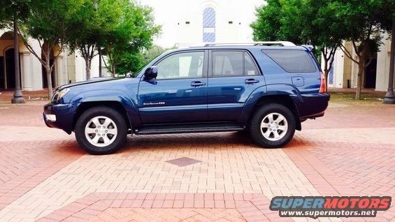 Blue 2005 Toyota 4Runner parked on brick pavement