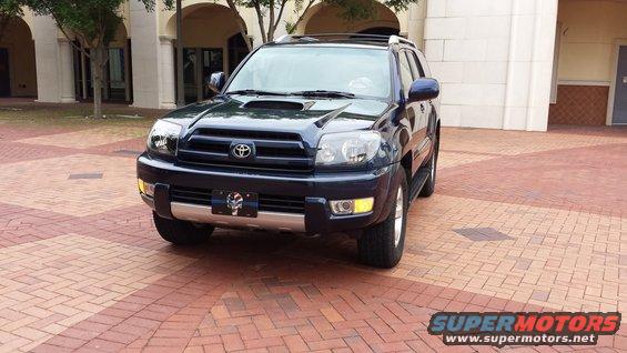 2005 Toyota 4Runner parked on brick patio in front of building