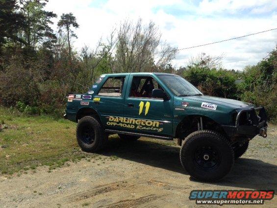 Green off-road SUV with number 11 and Darlington Off-Road Racing decals
