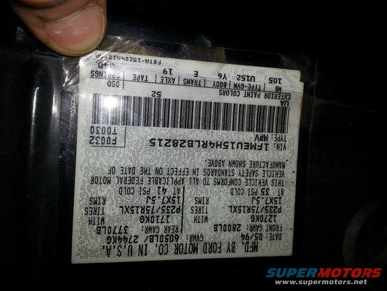 VIN sticker on a 1994 Ford vehicle. Shows manufacture date 05/94