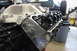 1979 Ford Bronco - A V8 engine with a "Super Cobra Jet" valve cover is shown in a workshop setting.
