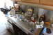 1979 Ford Bronco - Various automotive parts and tools are laid out on a metal workbench.
