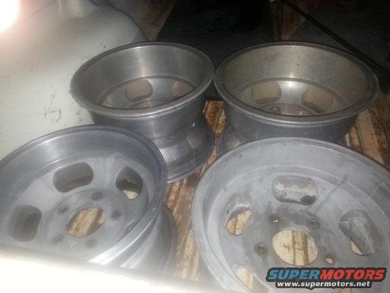 four aluminum wheels with five lug holes