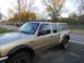 2000 Ford Ranger - This 2000 Ford Ranger is equipped with a camper shell and a roof rack system for carrying outdoor gear.