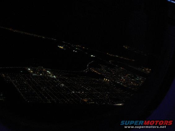 view of city lights from above at night