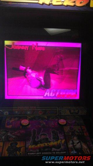 Video game screen displaying 'Johnny Neo' with a character in a pink-tinted scene and game controls below