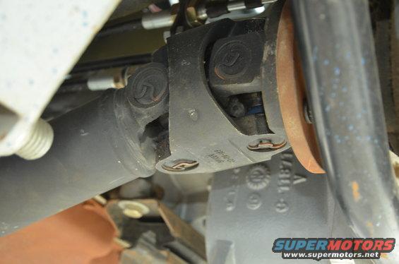 Drive shaft U-joint with visible part numbers