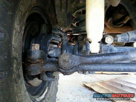 1995 Ford Bronco front suspension with tie rod and ball joint visible
