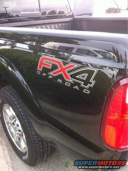 Black pickup truck rear quarter panel with FX4 Off Road decal