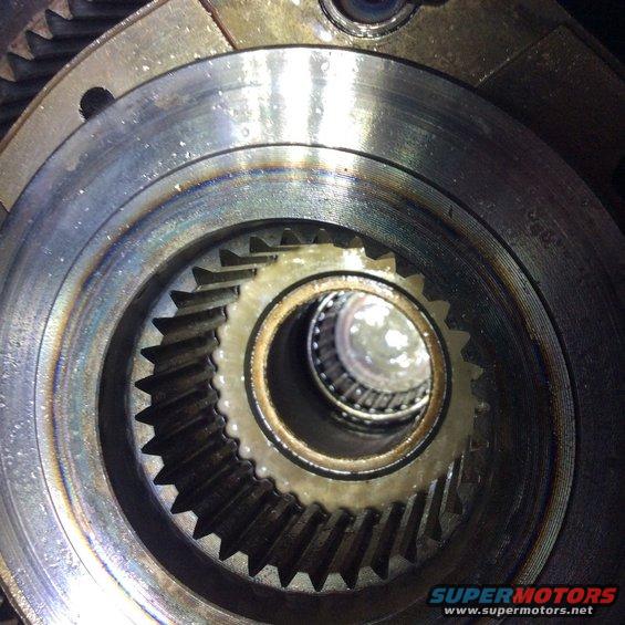 Close-up of differential gears with visible wear and grease