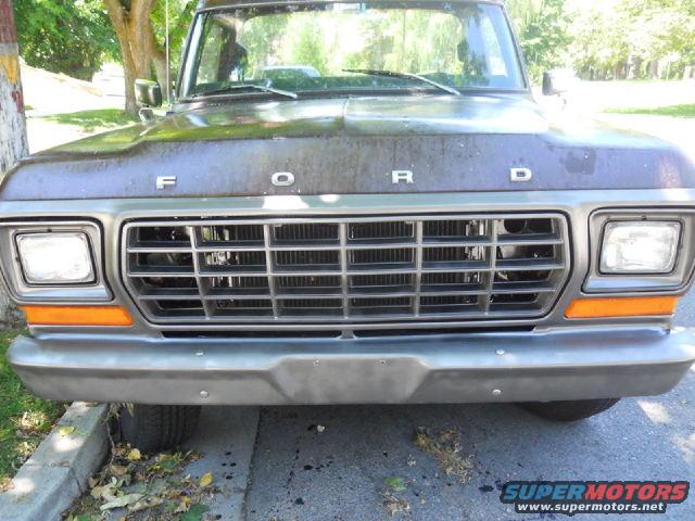 1979 Ford Bronco front grille with orange turn signals and 'FORD' lettering on the hood