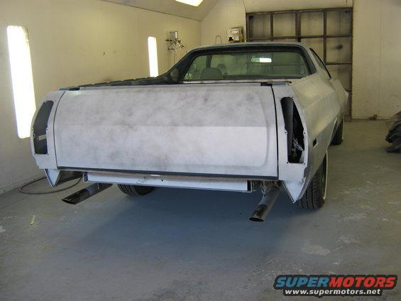 Primer-gray 1973 Ford Ranchero rear view with dual exhaust