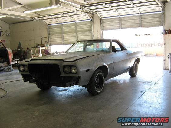 1973 Ford Ranchero project car in garage, front end partially disassembled