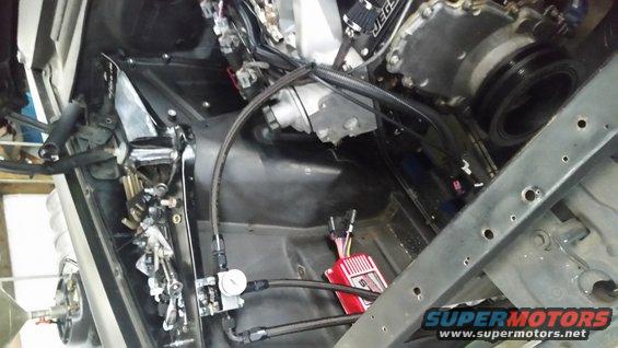 Engine bay with JEGS air intake, custom fuel lines, and a red ignition box