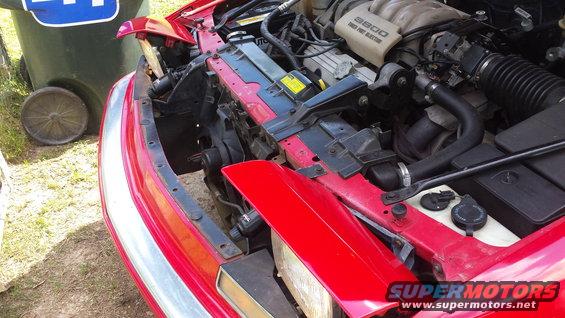 1991 Buick Reatta engine bay with 3800 V6 engine, red exterior, and visible radiator