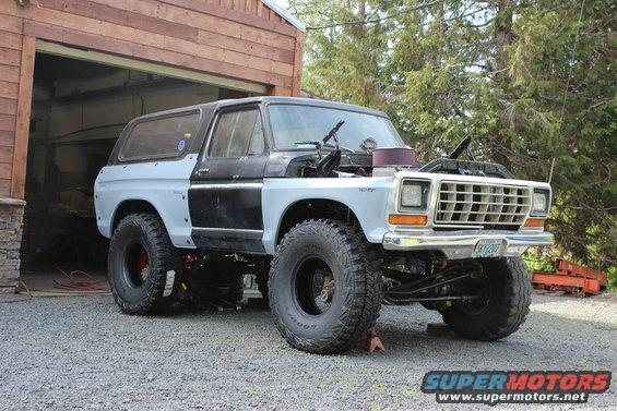 1979 Ford Bronco 3q-front view, hood open, lifted with large tires