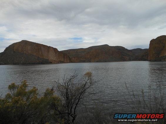 Lake and mountains under a cloudy sky