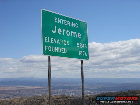 Sign entering Jerome, Arizona, showing elevation 5246 and founded 1876