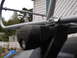 1964 Volkswagen Beetle - A close-up view of a black Thule roof rack mount and silver rack bar.