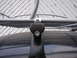 1964 Volkswagen Beetle - Close-up of a Thule roof rack mount attached to a dark vehicle surface.