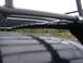 1964 Volkswagen Beetle - This image shows a close-up view of a roof rack system mounted on a vehicle's roof.
