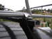 1964 Volkswagen Beetle - A close-up view of a roof rack system mounted on a vehicle, with a distant landscape visible.
