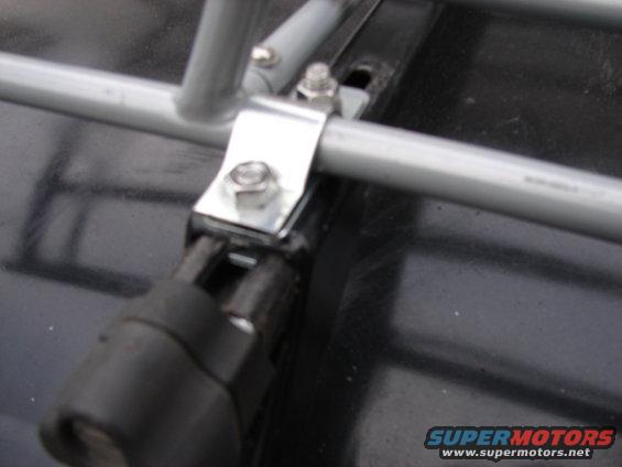 Roof rack mounting hardware on dark surface