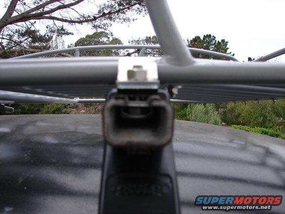 Close-up of a roof rack mount attached to a vehicle's roof