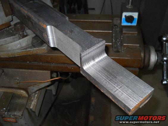 Machined metal part with curved edges on a milling machine