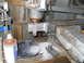 1992 Ford Bronco - A milling machine is actively cutting a metal workpiece, creating a significant amount of metal shavings.
